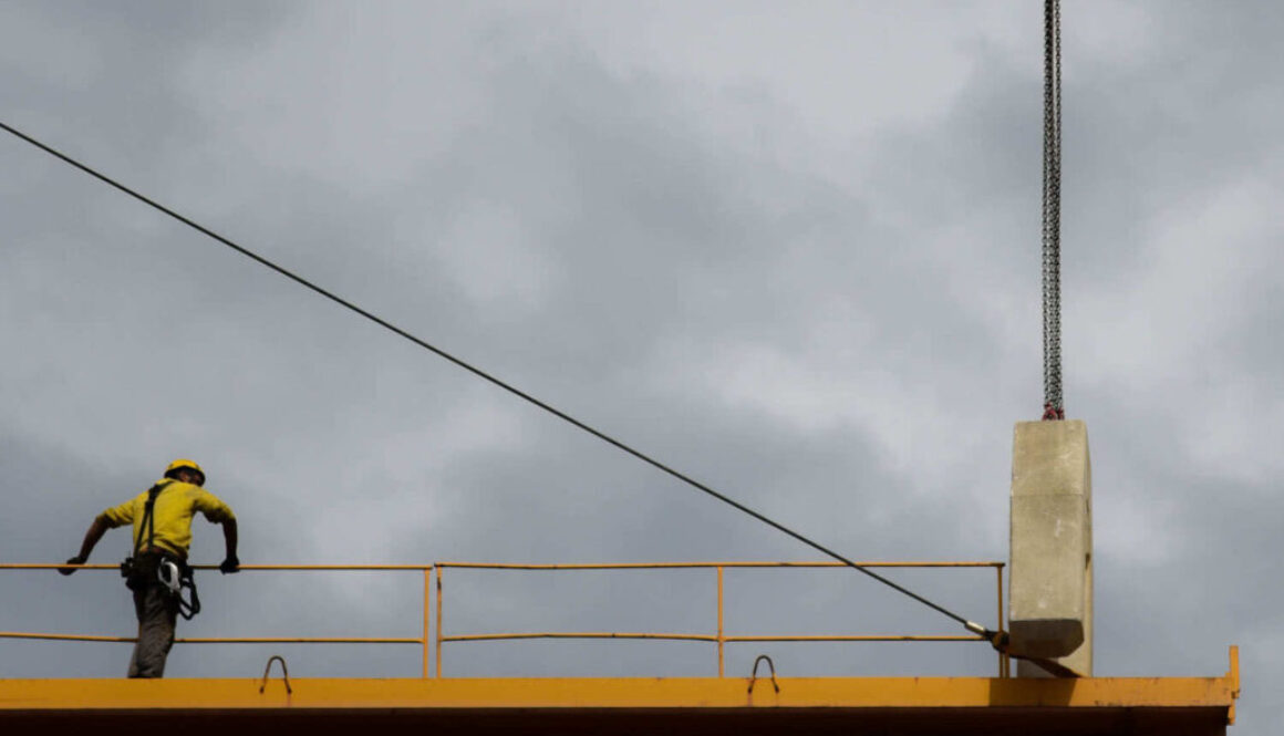 man stand on crane